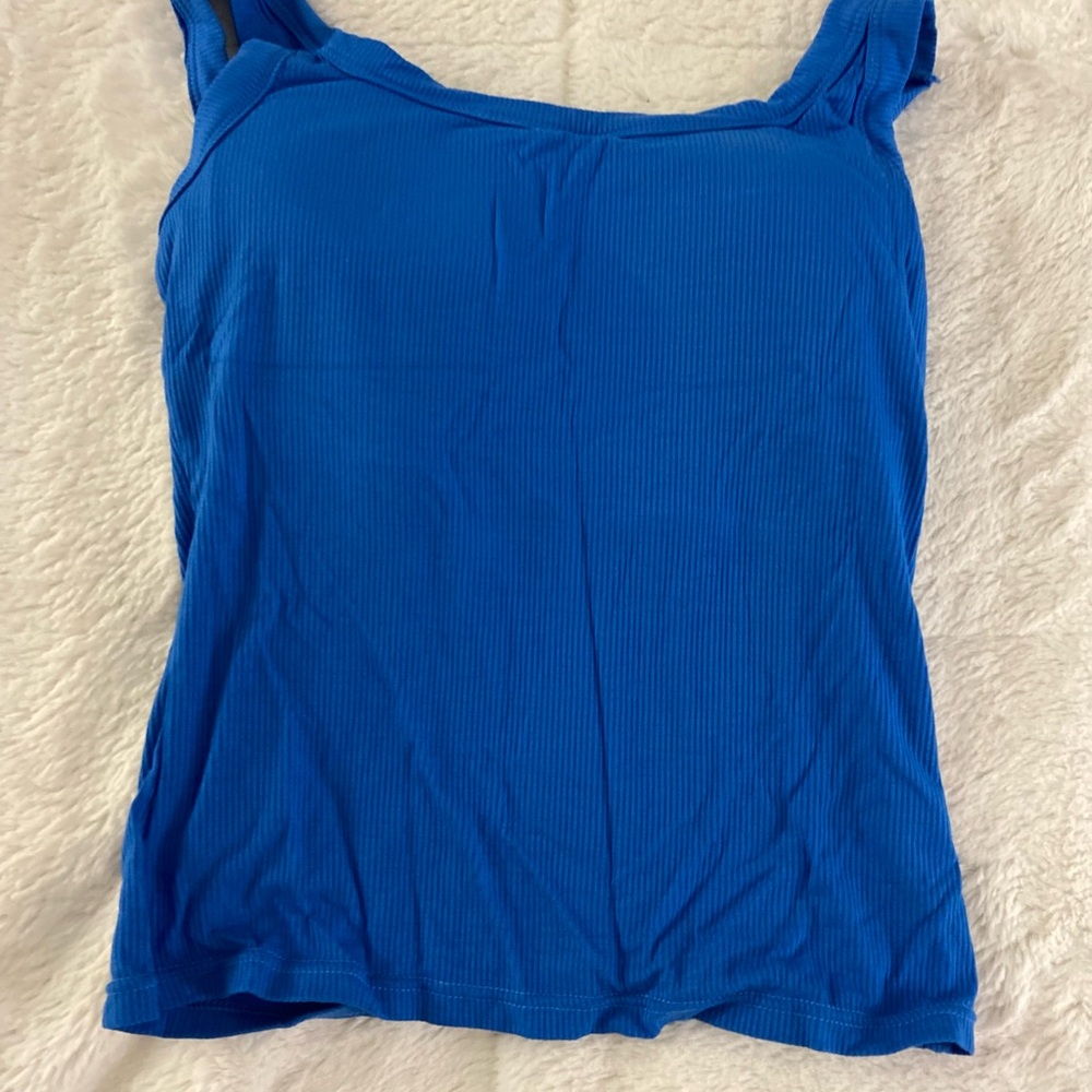 Tank top with built in pads. Never worn. It is very cute!